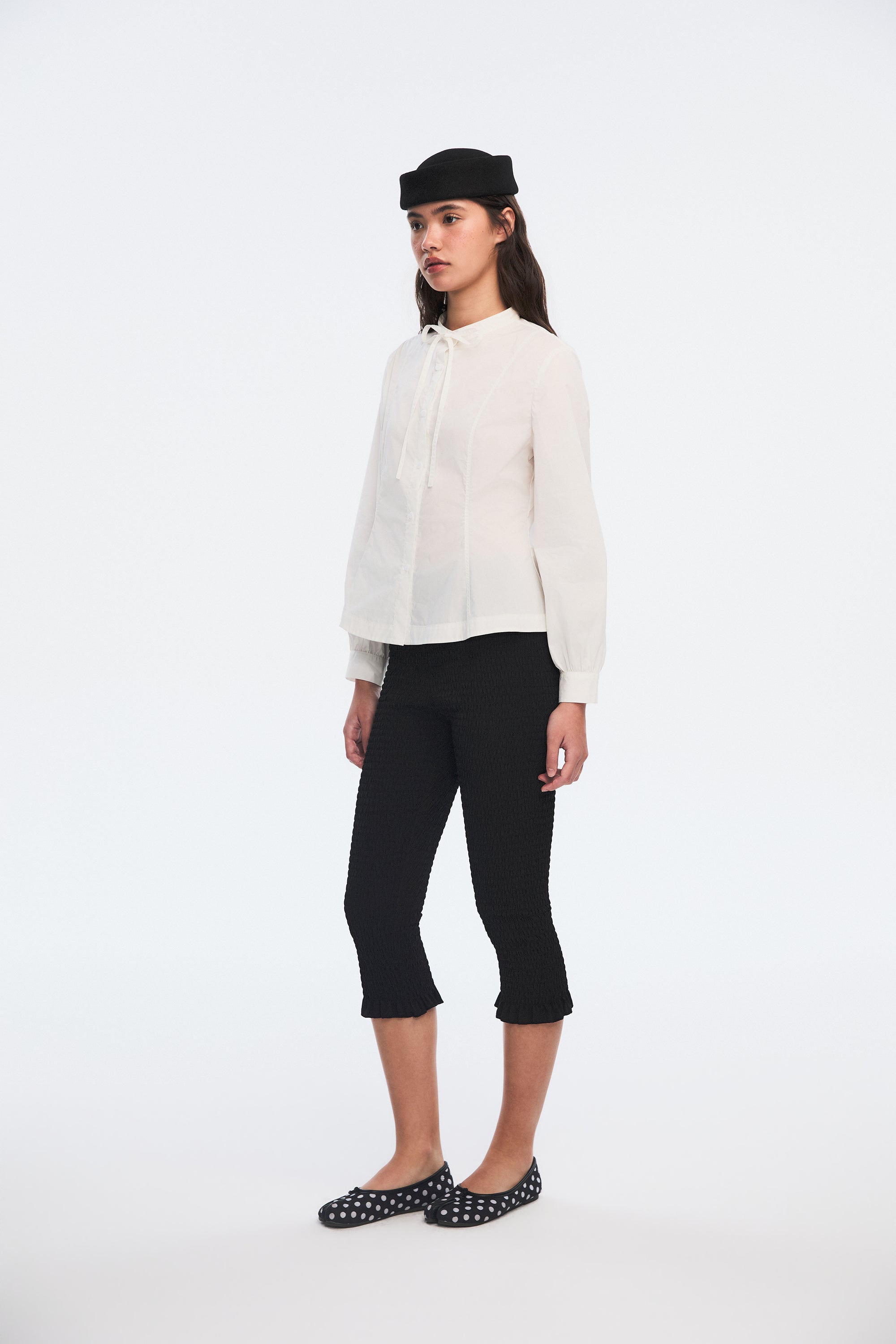 OTHER STORE Ripple Smocked Ruffle-Hem Capri Leggings in Black