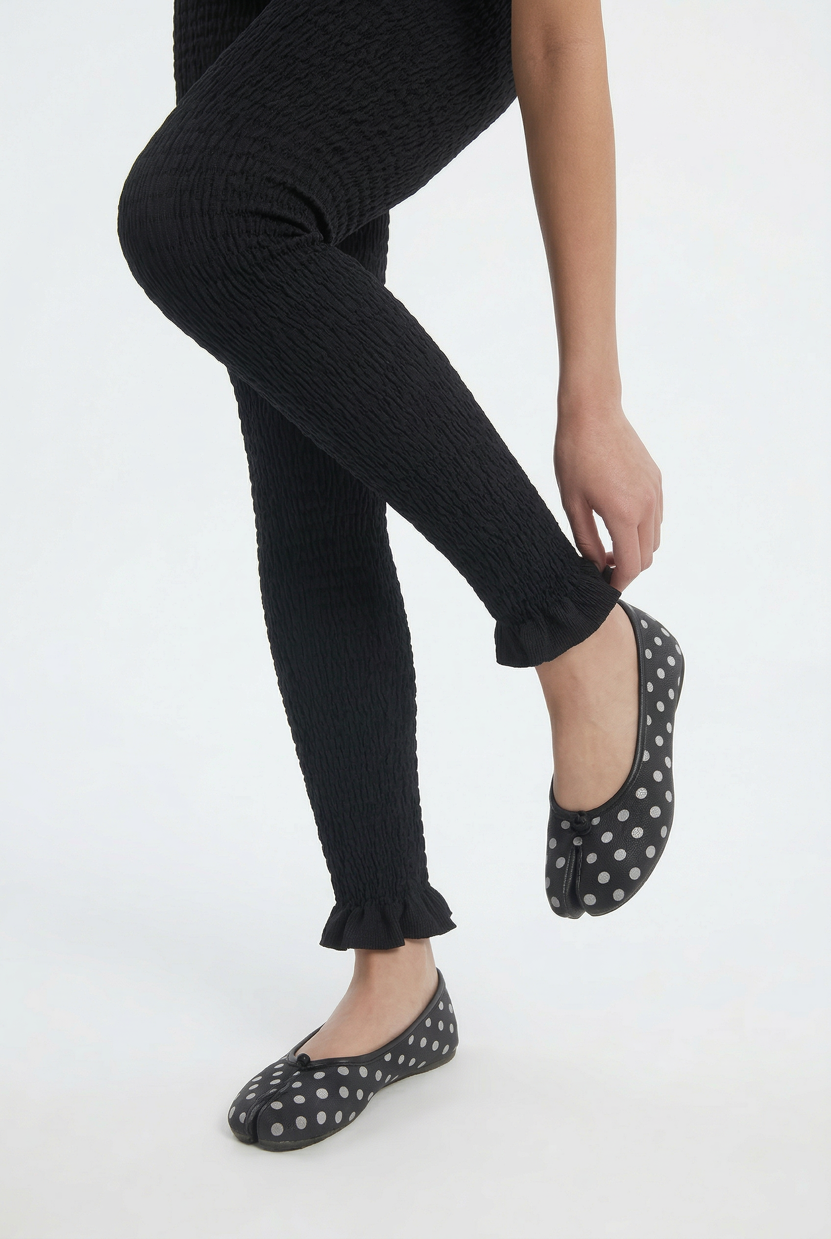 OTHER STORE Ripple Smocked Ruffle-Hem Cropped Leggings in Black