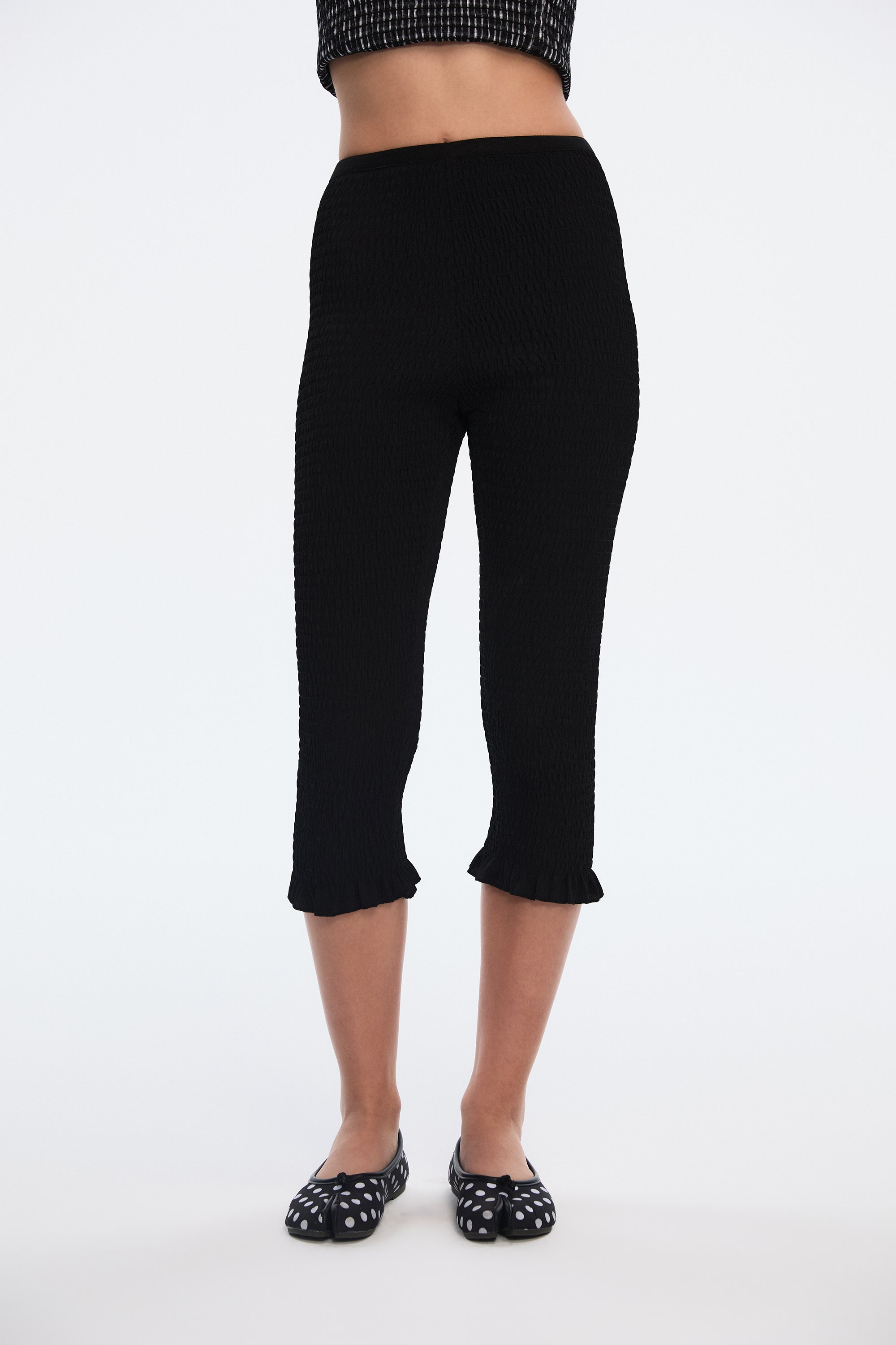 OTHER STORE Ripple Smocked Ruffle-Hem Capri Leggings in Black