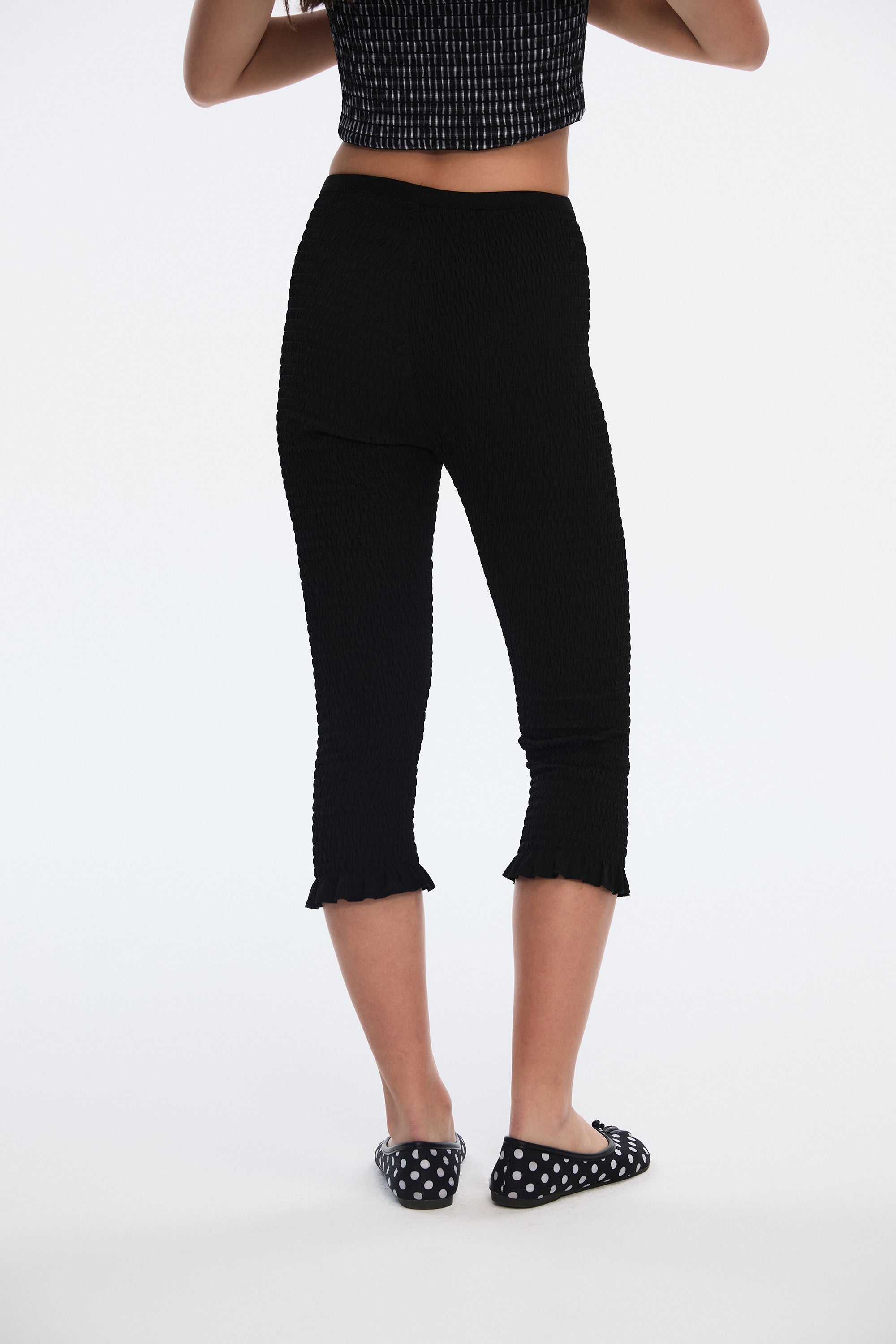 OTHER STORE Ripple Smocked Ruffle-Hem Capri Leggings in Black