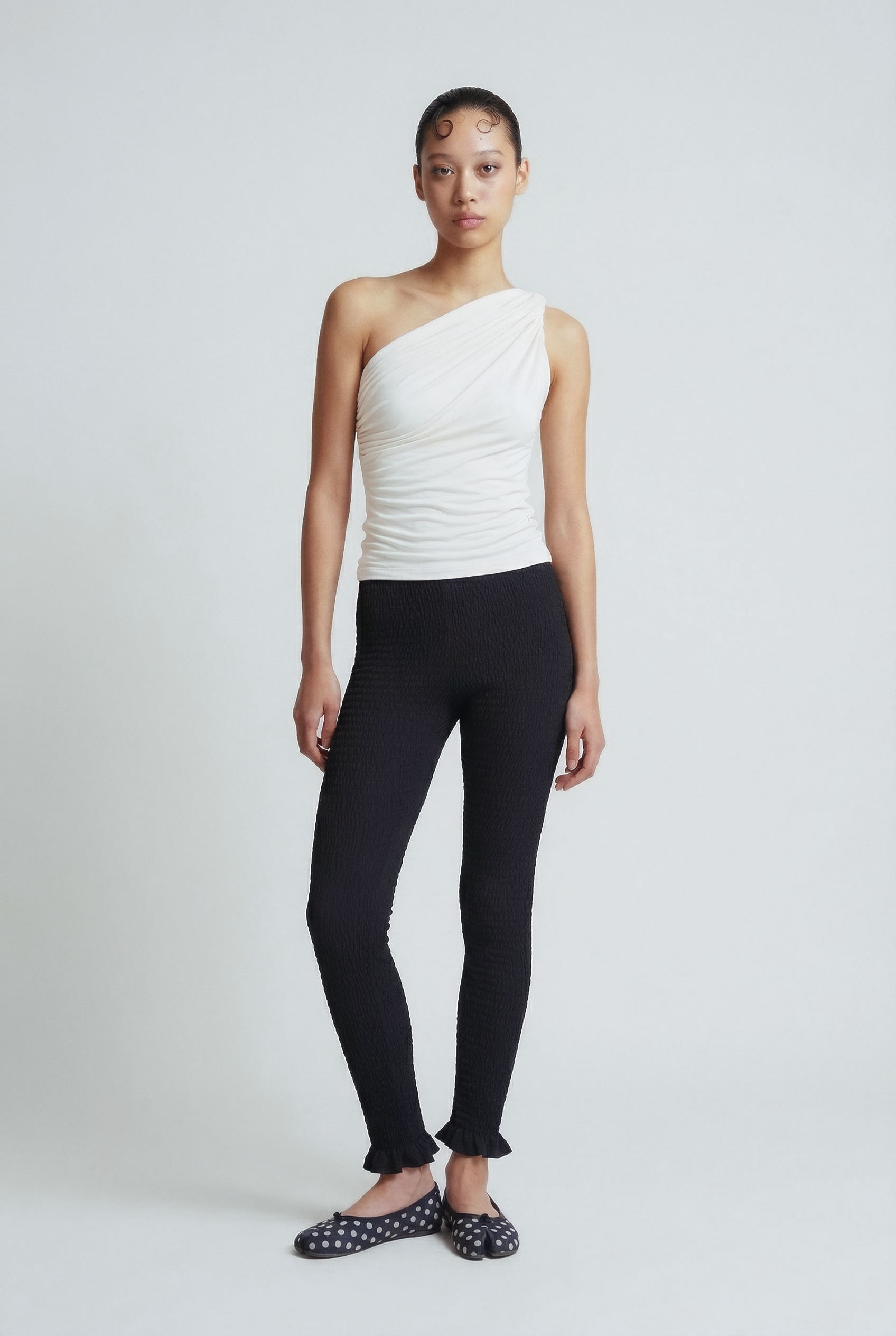 OTHER STORE Ripple Smocked Ruffle-Hem Cropped Leggings in Black